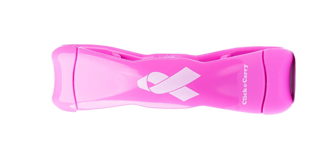 Closeup of a pink Click & Carry grocery bag carrier with a breast cancer awareness ribbon on the middle of it