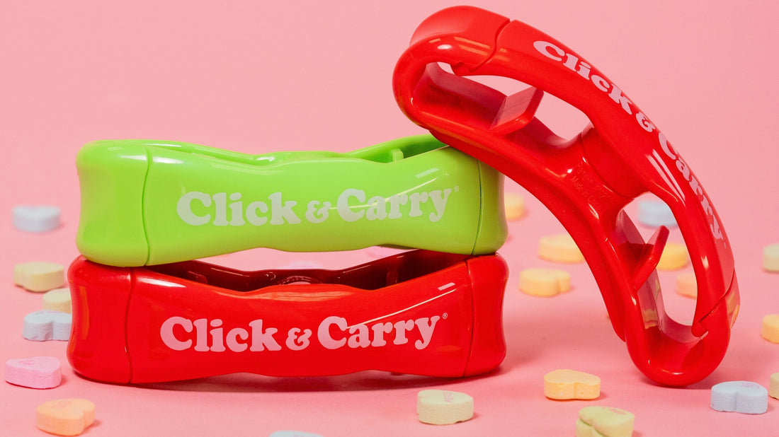 Red and green shopping bag carriers stacked in a pile surrounded by heart-shaped hard candies